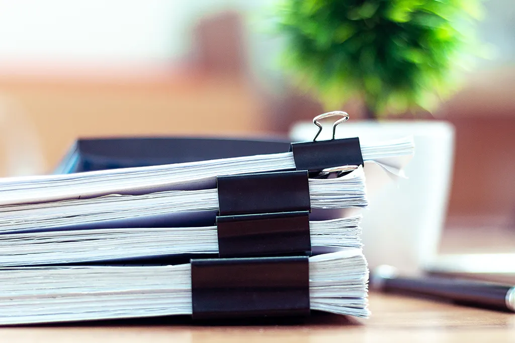 Stack of papers describing tree ordinances in the Bay Area CA